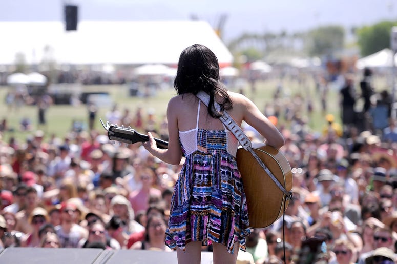 INDIO, CA - APRIL 16: Musician Thao Nguyen of the band Thao with the Get Down Stay Down performs during Day 2 of the Coachella Valley Music & Arts Festival 2011 held at the Empire Polo Club on April 16, 2011 in Indio, California. (Photo by Frazer Harrison