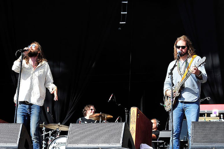 Chris Robinson and Rich Robinson of The Black Crowes perform in concert.