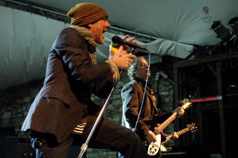 AUSTIN, TX - MARCH 12: Michael Stipe (L) and Peter Buck of REM perform at Stubbs BBQ as part of SxSw 2008 on March 12, 2008 in Austin, Texas. (Photo by Tim Mosenfelder/Getty Images)
