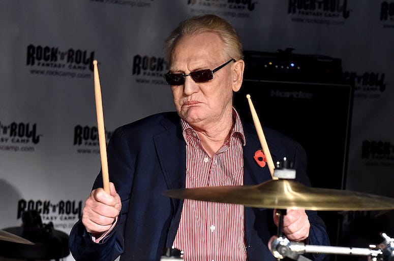 Cream Drummer Ginger Baker plays drums at a rock and roll fantasy camp.