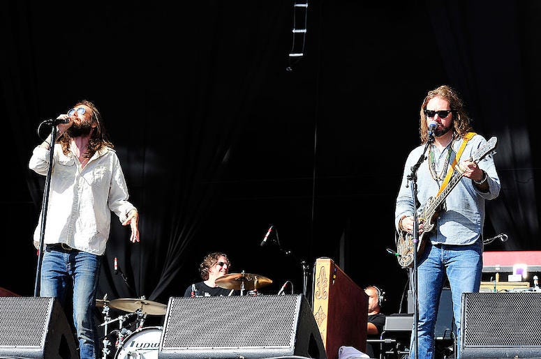 Chris Robinson and Rich Robinson of The Black Crowes perform in concert.