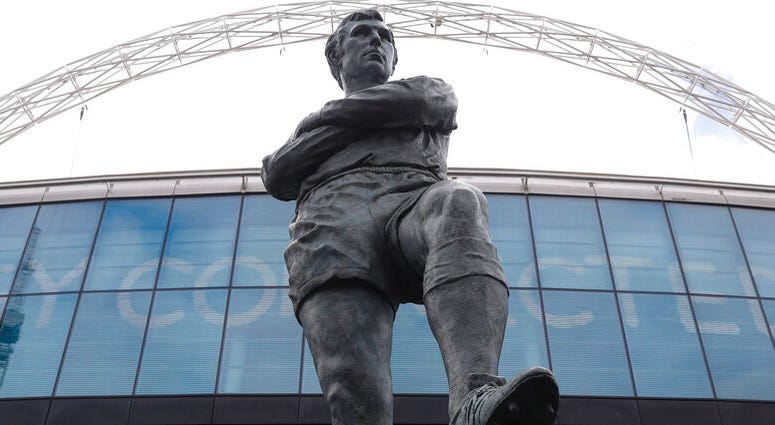 Bobby Moore outside Wembley Stadium in London