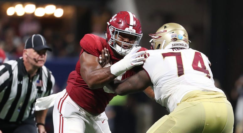 Sep 2, 2017; Atlanta, GA, USA; Alabama Crimson Tide defensive lineman Da'Shawn Hand (9) plays against Florida State Seminoles offensive lineman Derrick Kelly II (74) in their game at Mercedes-Benz Stadium.