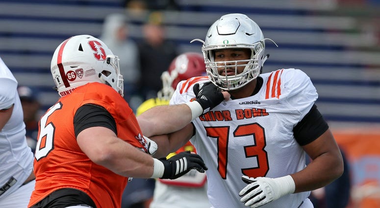 Jan 24, 2018; Mobile, AL, USA; North Squad offensive tackle Tyrell Crosby of Oregon (73) blocks defensive tackle Harrison Phillips of Stanfor (66) during Senior Bowl practice at Ladd-Peebles Stadium.
