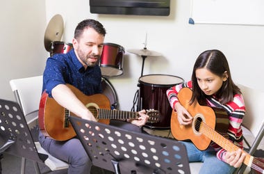 Man teaching child music