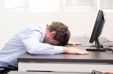 guy with head on his desk