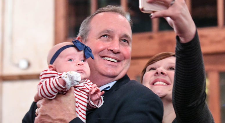 U.S. Rep. Jeff Duncan, middle, holds Ellyson Duncan, the baby of his niece in law Somer Duncan, right, getting a selfie photo, minutes before he was projected to win his fifth term in District 3, during election night party in Anderson on Tuesday, Novembe U.S. Rep. Jeff Duncan, middle, holds Ellyson Duncan, the baby of his niece in law Somer Duncan, right, getting a selfie photo, minutes before he was projected to win his fifth term in District 3, during election night party in Anderson on Tuesday, Novembe