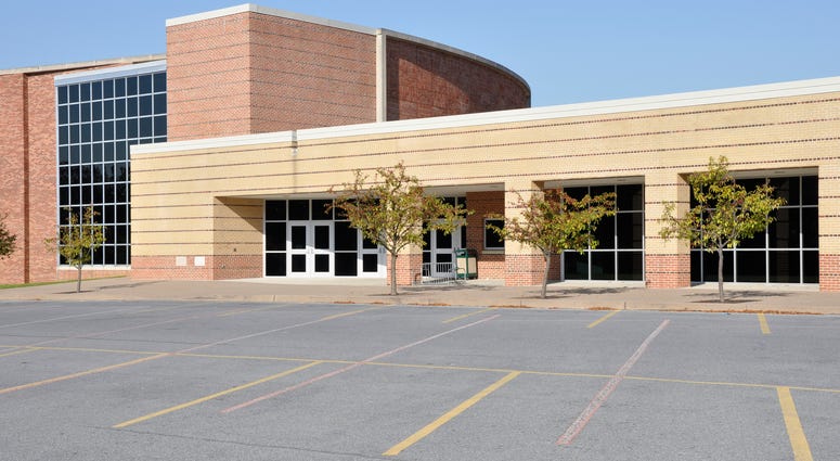 To download school assisgnments, Wi-Fi can be accessed in a school parking lot To download school assisgnments, Wi-Fi can be accessed in a school parking lot