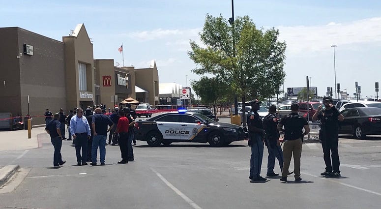 Police gather outside the Walmart at Cielo Vista Mall where an active shooter was reported.