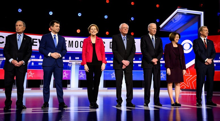 Democratic presidential candidates Michael Bloomberg, Pete Buttigieg, Elizabeth Warren, Bernie Sanders, Joe Biden, Amy Klobuchar and Tom Steyer walk onto the stage during the South Carolina Democratic debate in Charleston Tuesday, Feb. 25, 2020. Democratic presidential candidates Michael Bloomberg, Pete Buttigieg, Elizabeth Warren, Bernie Sanders, Joe Biden, Amy Klobuchar and Tom Steyer walk onto the stage during the South Carolina Democratic debate in Charleston Tuesday, Feb. 25, 2020.