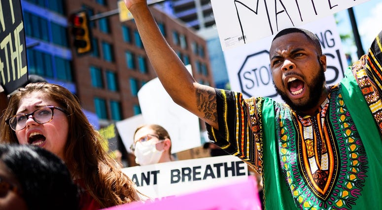 Marquelle Dortch participates in a protest against police brutality outside of the Peace Center Saturday, May 30, 2020. Marquelle Dortch participates in a protest against police brutality outside of the Peace Center Saturday, May 30, 2020.