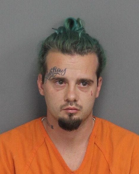 Austin William McDonald. Tatoo reads "Ambitious."