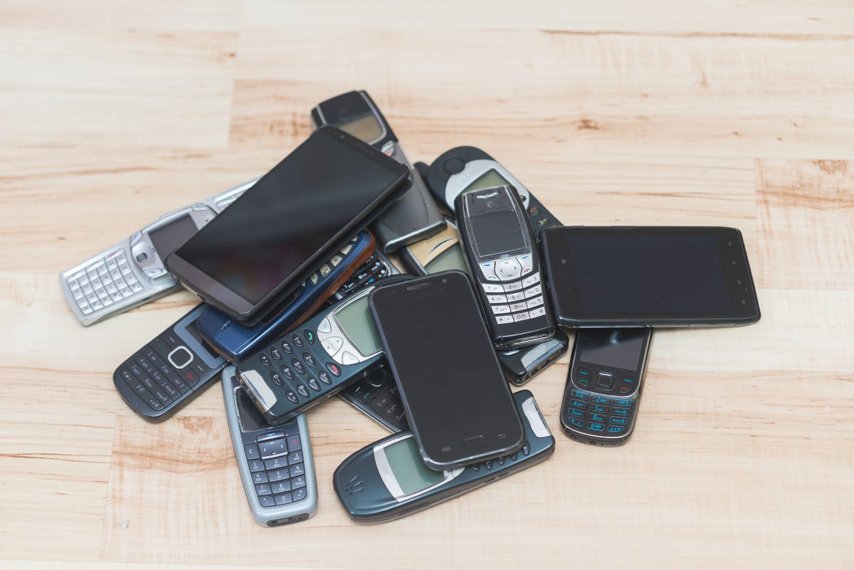 pile of old cellphones pile of old cellphones