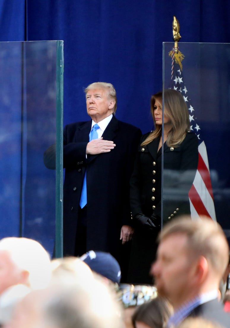 President Donald Trump and First Lady Melania Trump look on during the wreath laying ceremony before the start of the Veterans Day Parade in Madison Square Park in New York City Nov. 11, 2019. Trump Veterans Day