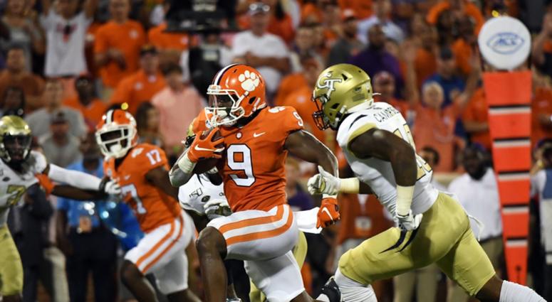 Aug 29, 2019; Clemson, SC, USA; Clemson Tigers running back Travis Etienne (9) scores a touchdown against the Georgia Tech Yellow Jackets during the second quarter at Clemson Memorial Stadium.
