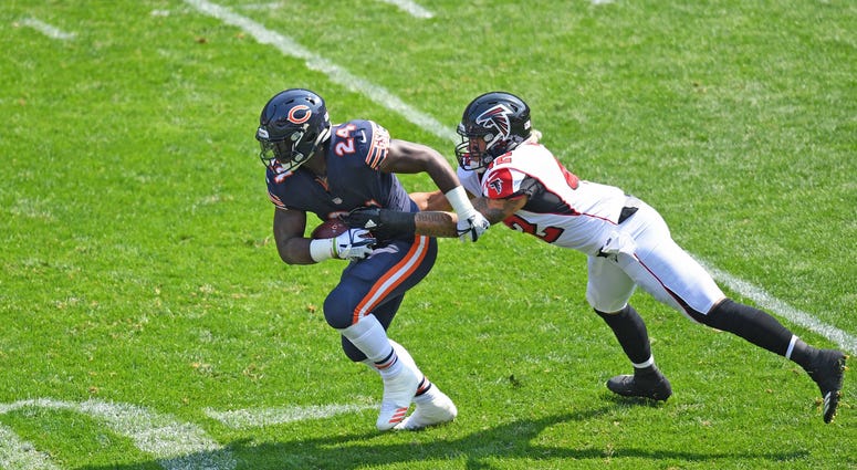 Atlanta Falcons outside linebacker Duke Riley (42) attempts to tackle Chicago Bears running back Jordan Howard (24) during a game at Soldier Field