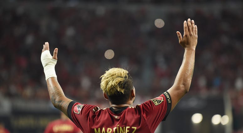 Atlanta United forward Josef Martinez (7) celebrates after scoring a hat trick on a penalty kick against the Philadelphia Union during the second half at Mercedes-Benz Stadium.