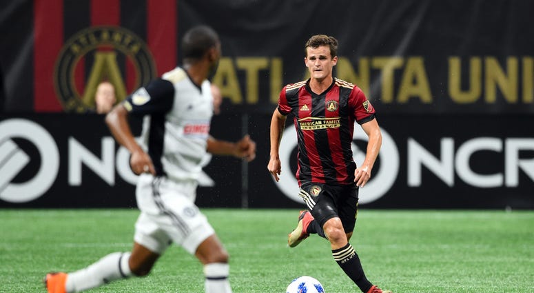 Atlanta United defender Mikey Ambrose (22) handles the ball against Philadelphia Union defender Ray Gaddis (28) during the second half at Mercedes-Benz Stadium