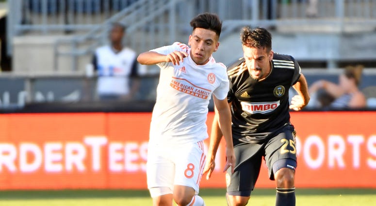 Atlanta United midfielder Ezequiel Barco (8) pushes past Philadelphia Union midfielder Ilsinho (25) during the first half at Talen Energy Stadium.