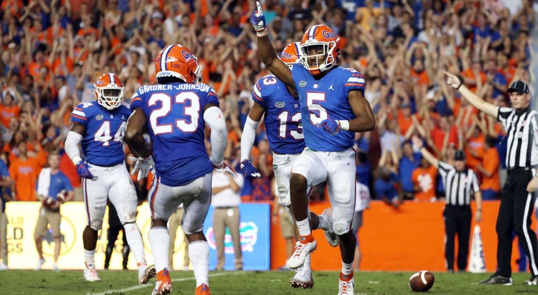 Sep 8, 2018; Gainesville, FL, USA; Florida Gators defensive back CJ Henderson (5) celebrates as he intercepted the ball during the second quarter against the Kentucky Wildcats at Ben Hill Griffin Stadium. Mandatory Credit: Kim Klement-USA TODAY Sports