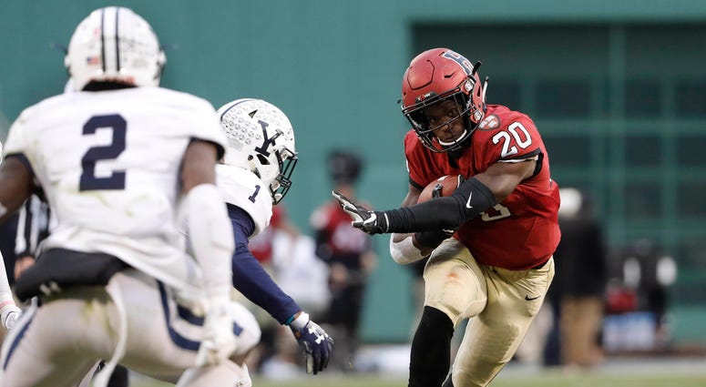 Nov 17, 2018; Boston, MA, USA; Harvard running back Aaron Shampklin (20) runs against the Yale during the second half at Fenway Park. Mandatory Credit: Winslow Townson-USA TODAY Sports