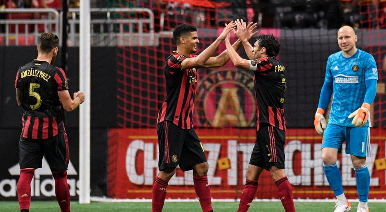 Atlanta United Defenders Leando Gonzalez Pirez, Miles Robinson, and Michael Parkhurst, and Goalie Brad Guzan