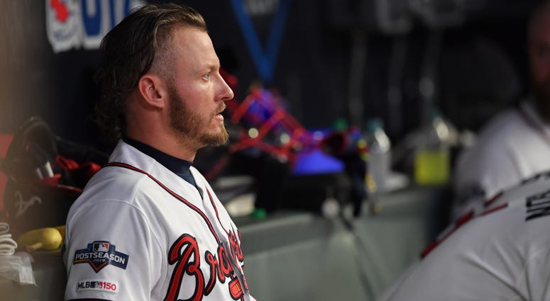 Oct 9, 2019; Atlanta, GA, USA; Atlanta Braves third baseman Josh Donaldson (20) looks out from the dugout during the sixth inning of game five of the 2019 NLDS playoff baseball series against the St. Louis Cardinals at SunTrust Park. Mandatory Credit: Dal