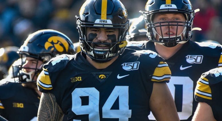 Nov 23, 2019; Iowa City, IA, USA; Iowa Hawkeyes defensive end A.J. Epenesa (94) enters the field before the game against the Illinois Fighting Illini at Kinnick Stadium. Mandatory Credit: Jeffrey Becker-USA TODAY Sports