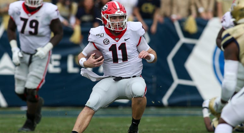 Nov 30, 2019; Atlanta, GA, USA; Georgia Bulldogs quarterback Jake Fromm (11) scrambles against the Georgia Tech Yellow Jackets in the first half at Bobby Dodd Stadium. Mandatory Credit: Brett Davis-USA TODAY Sports