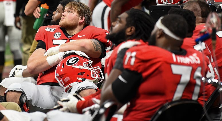 Georgia Bulldogs players watch the clock run down against the LSU Tigers during the second half in the 2019 SEC Championship Game