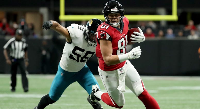 Dec 22, 2019; Atlanta, Georgia, USA; Atlanta Falcons tight end Austin Hooper (81) runs after a catch against Jacksonville Jaguars linebacker Austin Calitro (58) in the first quarter at Mercedes-Benz Stadium. Mandatory Credit: Jason Getz-USA TODAY Sports