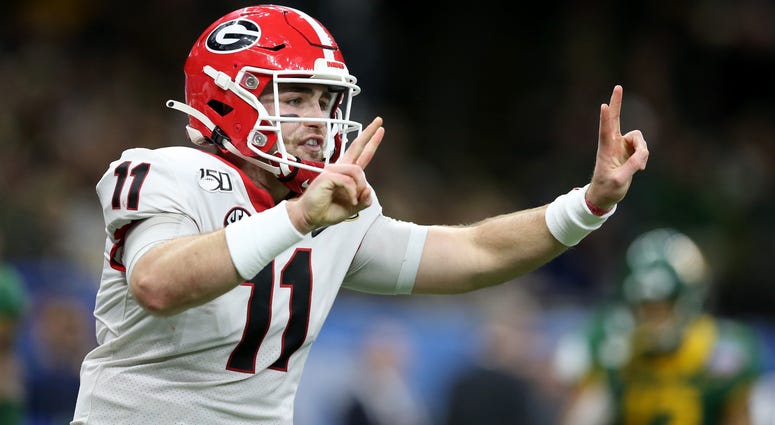 Jan 1, 2020; New Orleans, Louisiana, USA; Georgia Bulldogs quarterback Jake Fromm (11) gestures after a touchdown in the first half of the Sugar Bowl against the Baylor Bears at the Mercedes-Benz Superdome. Mandatory Credit: Chuck Cook-USA TODAY Sports
