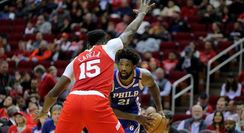 Clint Capela guarding Joel Embiid