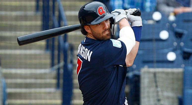 Atlanta Braves shortstop Dansby Swanson hits a single during the fourth inning of a game Atlanta Braves shortstop Dansby Swanson hits a single during the fourth inning of a game