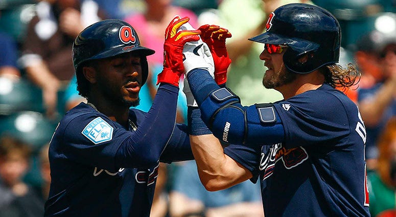 Atlanta Braves third baseman Josh Donaldson (20) celebrates with Atlanta Braves second baseman Ozzie Albies Atlanta Braves third baseman Josh Donaldson (20) celebrates with Atlanta Braves second baseman Ozzie Albies