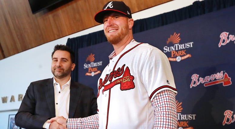 Atlanta Braves Executive Vice President and General Manager Alex Anthopoulos introduces left-handed pitcher Will Smith, who just signed a three-year, $39 million contract with a one-year club option, during a press conference at SunTrust Park on Tuesday,