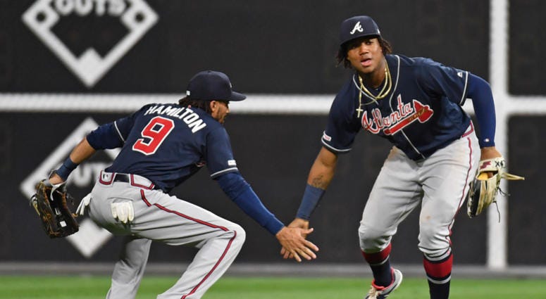 Atlanta Braves Outfielders Billy Hamilton (left) and Ronald Acuna Jr. (right)