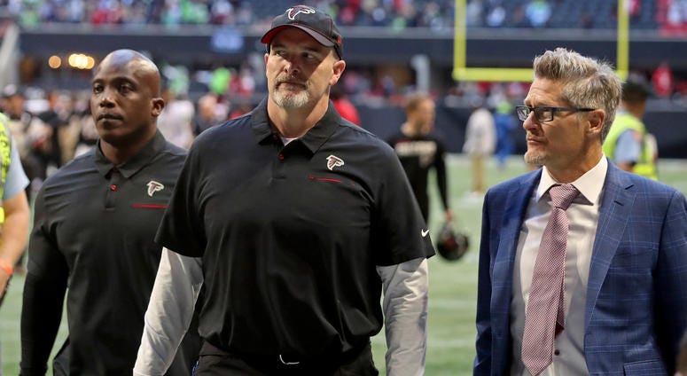 Oct 27, 2019; Atlanta, GA, USA; Atlanta Falcons head coach Dan Quinn (middle) leaves the field with general manager Thomas Dimitroff (right) after a loss to the Seattle Seahawks at Mercedes-Benz Stadium. Mandatory Credit: Jason Getz-USA TODAY Sports