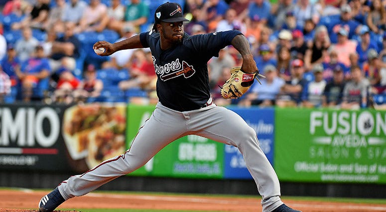 Atlanta Braves starting pitcher Touki Toussaint (62) delivers a pitch Atlanta Braves starting pitcher Touki Toussaint (62) delivers a pitch